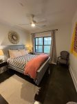 Lower level guest room with queen bed and en suite bath